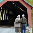Old Couple Marvels At Covered Bridge